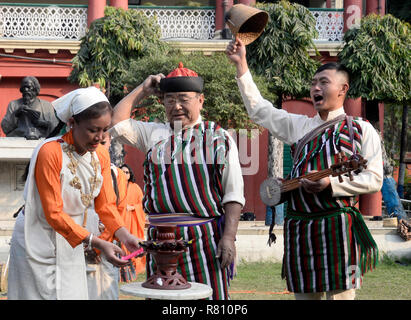 Kolkata`, India. 11th Dec, 2018. Lepcha woman light the lamp at a program to celebrate Lepcha New Year at Jorasanko Tahkur Bari the ancestral home Rabindranath Tagore. Credit: Saikat Paul/Pacific Press/Alamy Live News Stock Photo